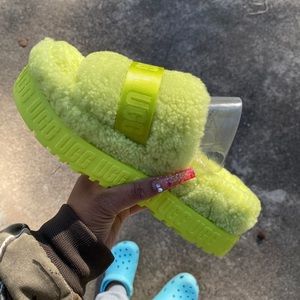 Neon green UGG slides